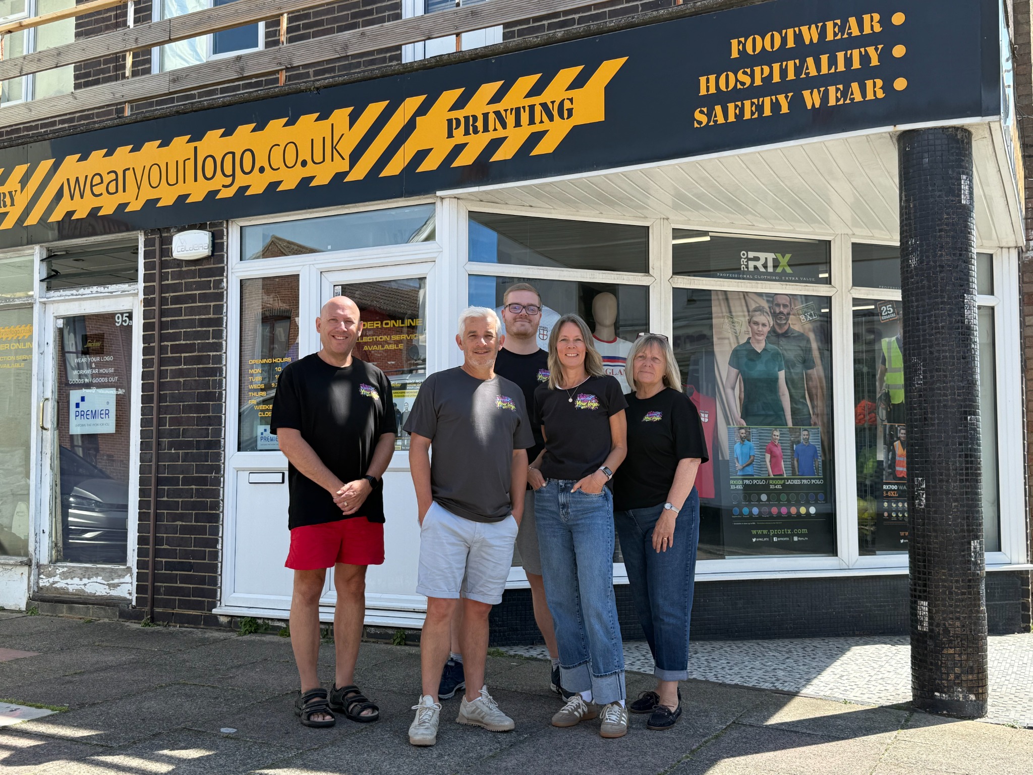 WearYourLogo team outside the Lancing shop